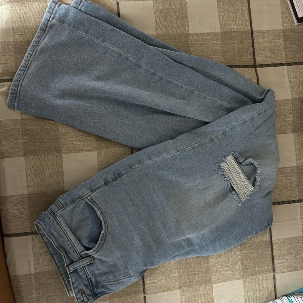 Light wash, super high rise wide-legged ripped jeans